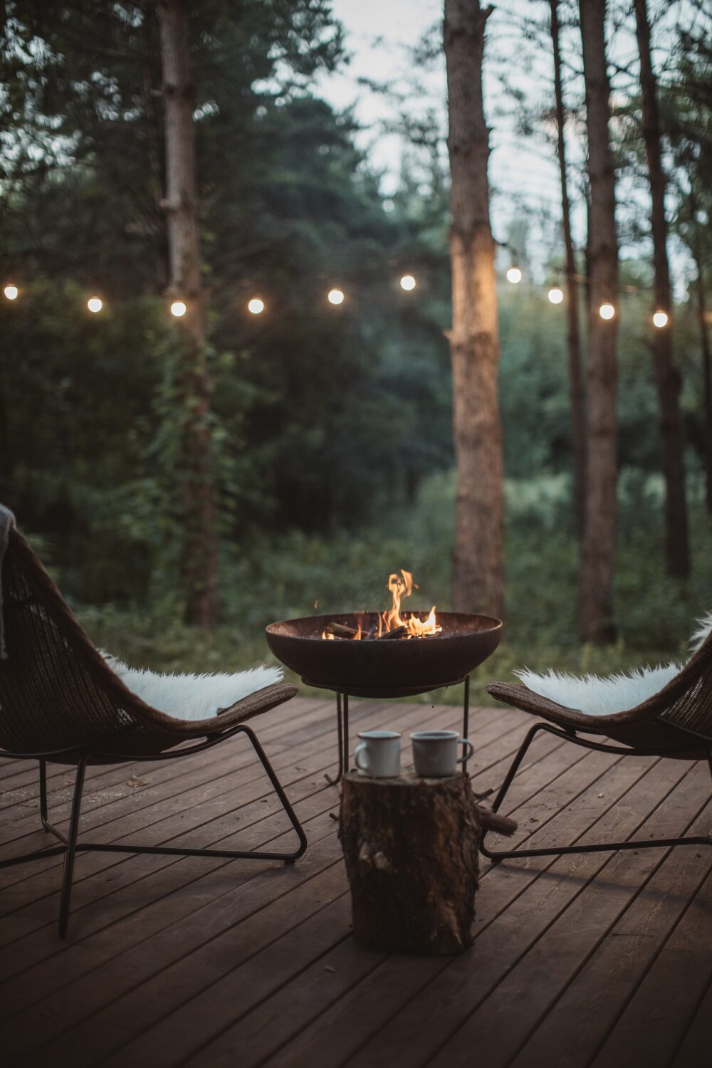 Cozy Outdoor Seating with Fire pit and string lights